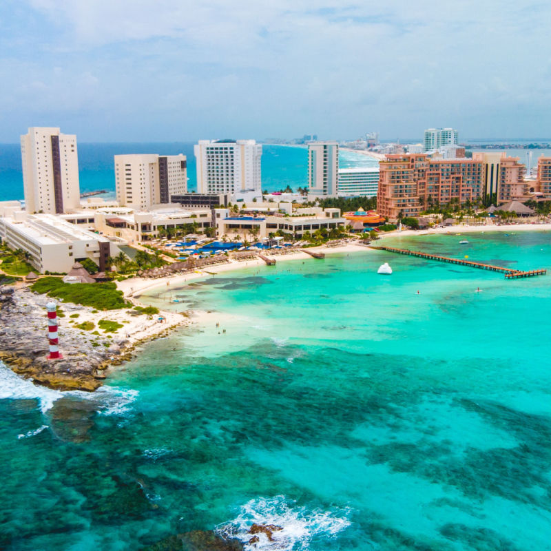 Aerial view of Cancun's resort zone with blue water 