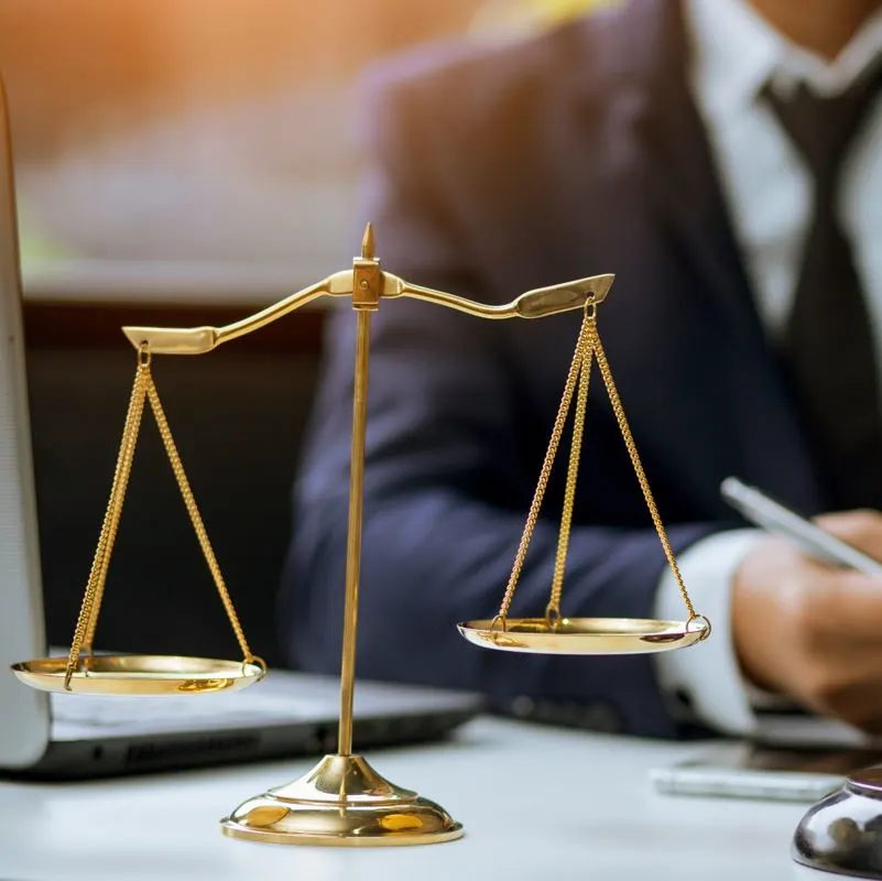 The scales of justice on a lawyers desk