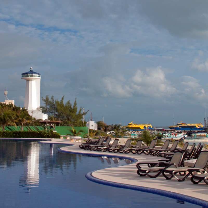 Lighthouse in Front of a Resort Pool in Puerto Juarez in Cancun, Mexico