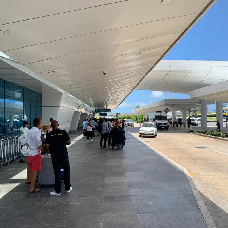 Tourists Outside of the Cancun Airport Departures Area