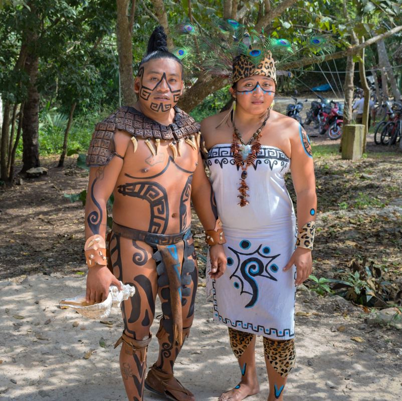 A Mayan couple dressed in traditional ceremonial style