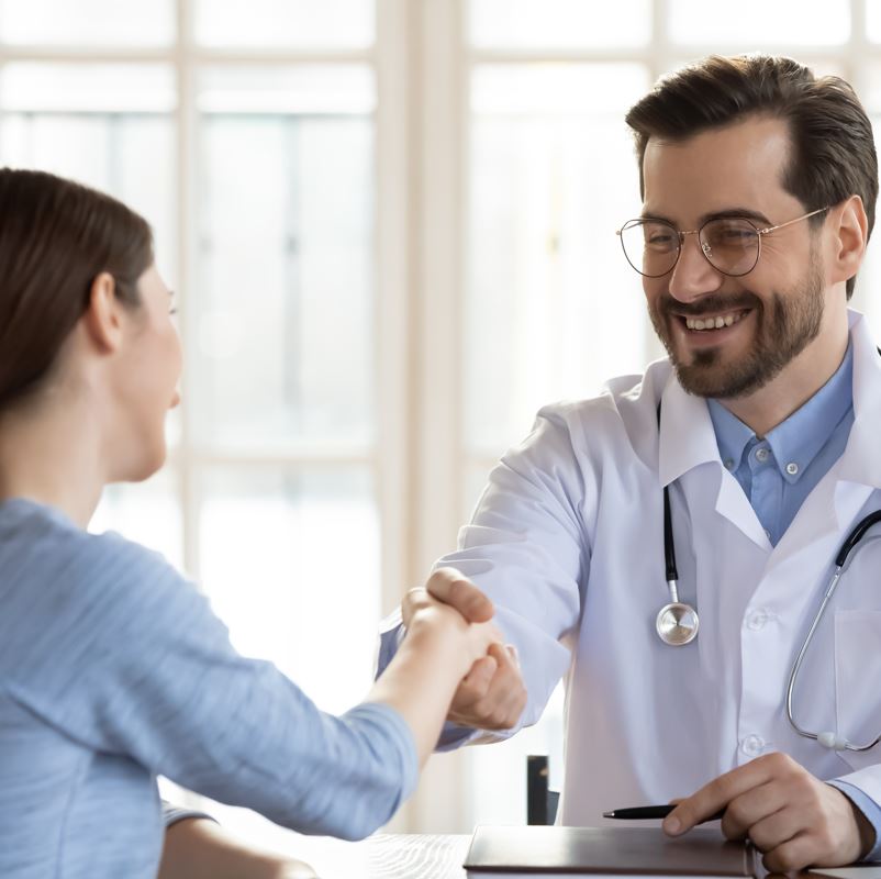 A doctor shaking a patients hand