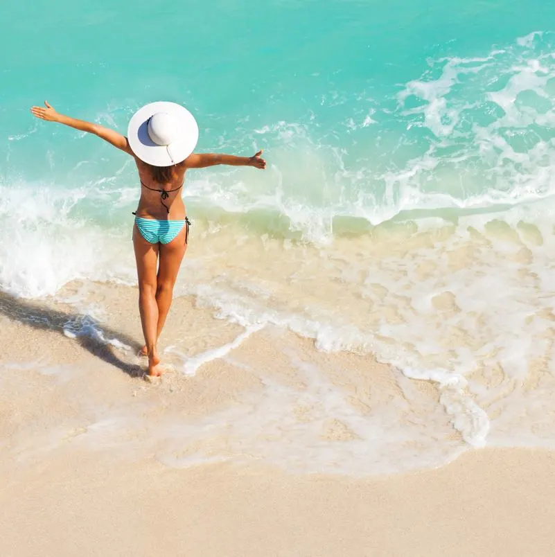 woman on the beach with ocean