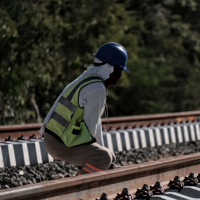 Maya Train worker building the tracks