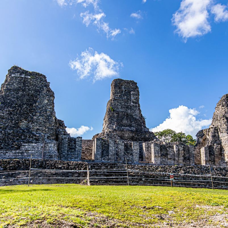 calakmul ruins against blue sky