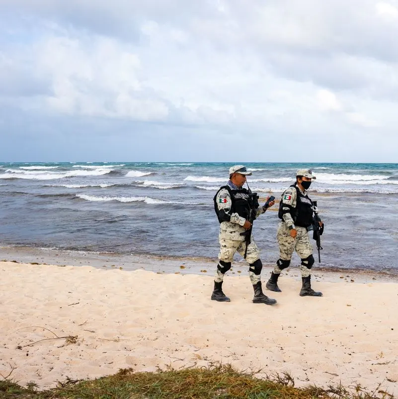 national guard troops patrolling on a beach
