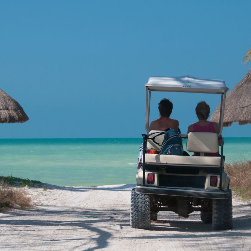 Golf cart heading to the beach in Holbox