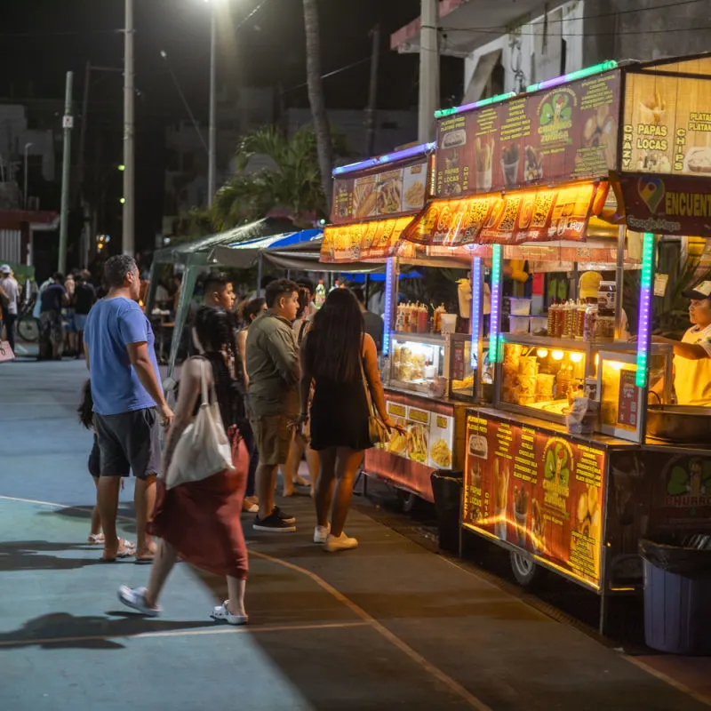 Isla Mujeres street food at night in a busy plaza