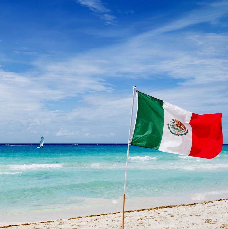 Mexican flag on a beach