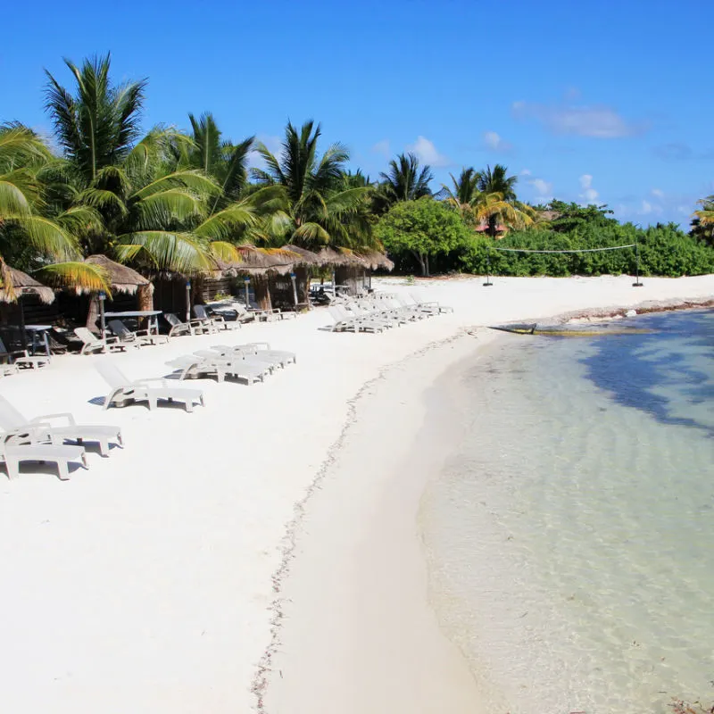 A calm beach in Costa Mujeres with white sand shore