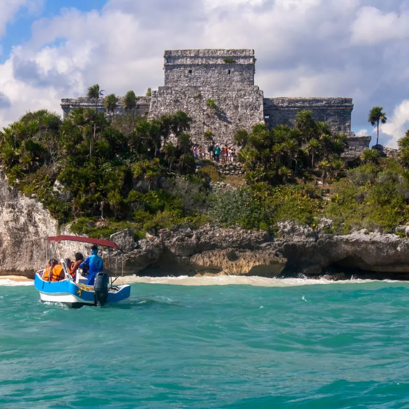 Tour Boat Taking Tourists to the Tulum Ruins