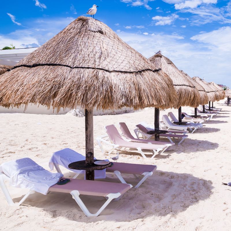 Sun loungers on a beach in Cancun