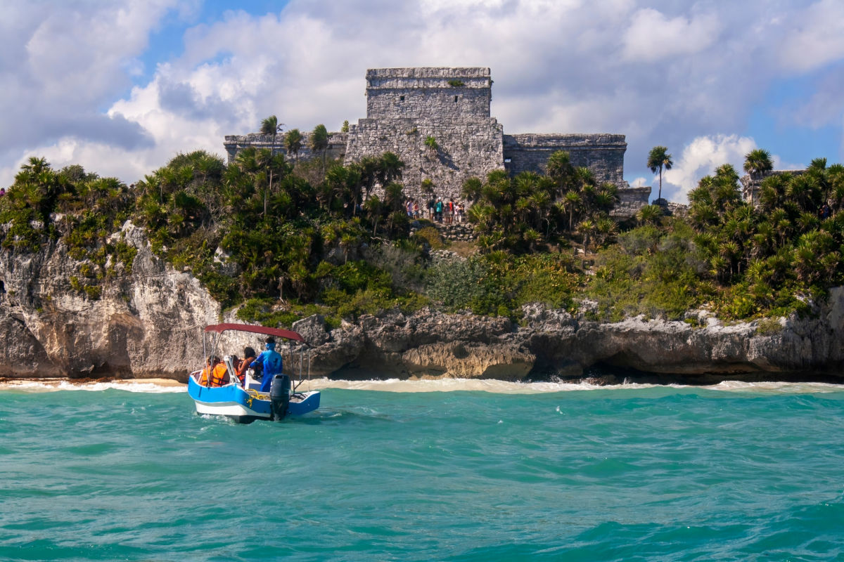 Tour Boat Taking Tourists to the Tulum Ruins