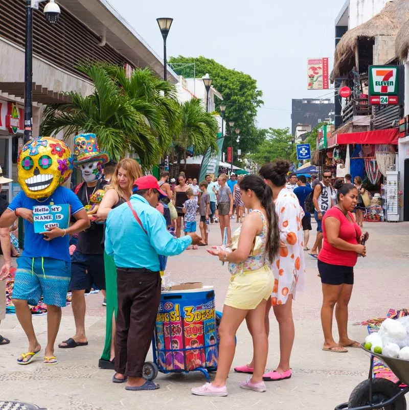 Tourists on a busy street in Playa del Carmen