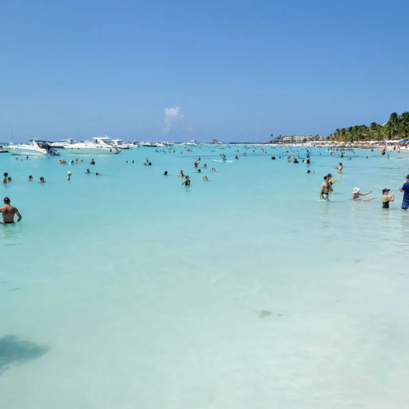 Travelers enjoying the crystal clear waters in Isla Mujeres