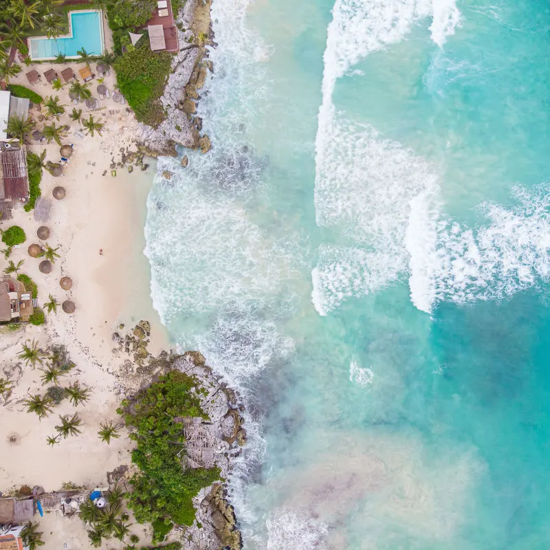 Aerial view of a Tulum beach with waves