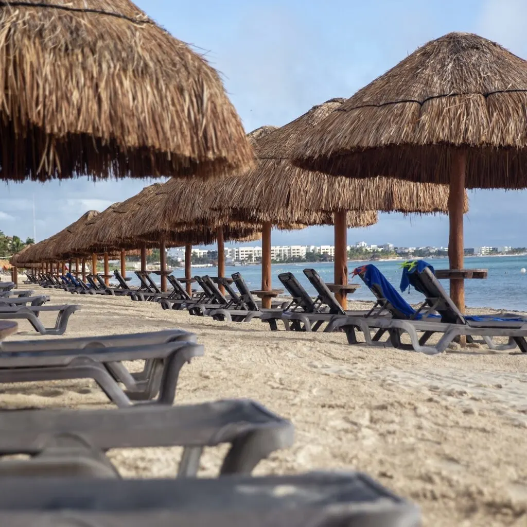 empty beach umbrellas cancun