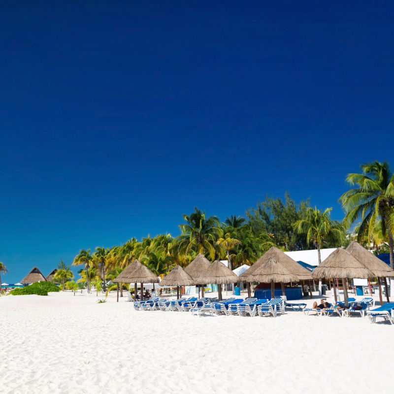 A white sand beach and blue sky in Cancun 
