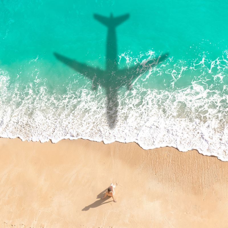 Airplane over beach