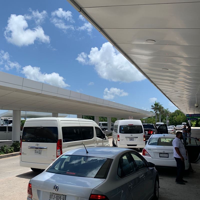 Cancun Airport with taxis on the outside 