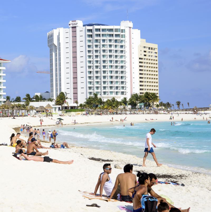 Tourists on a beach in Cancun.