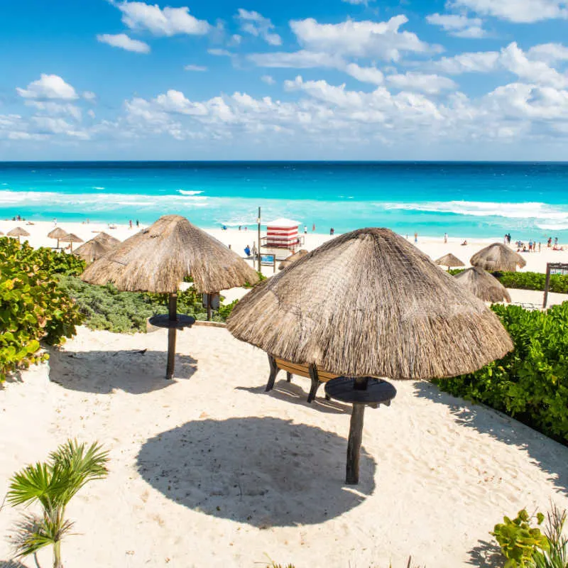A white sand beach in Cancun with blue water 