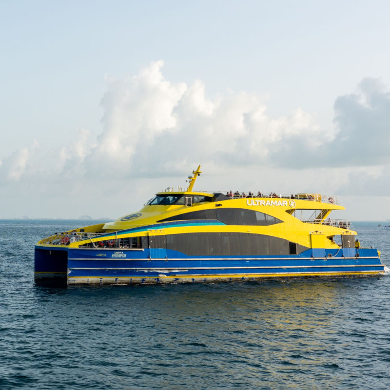 An ultramar ferry headed to isla mujeres from cancun 