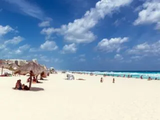 Tourists on Dolphin beach in Cancun, Yucatan peninsula.