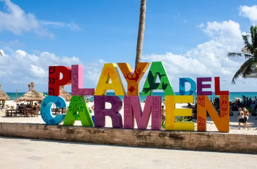 colourful Playa del Carmen sign on beach boardwalk