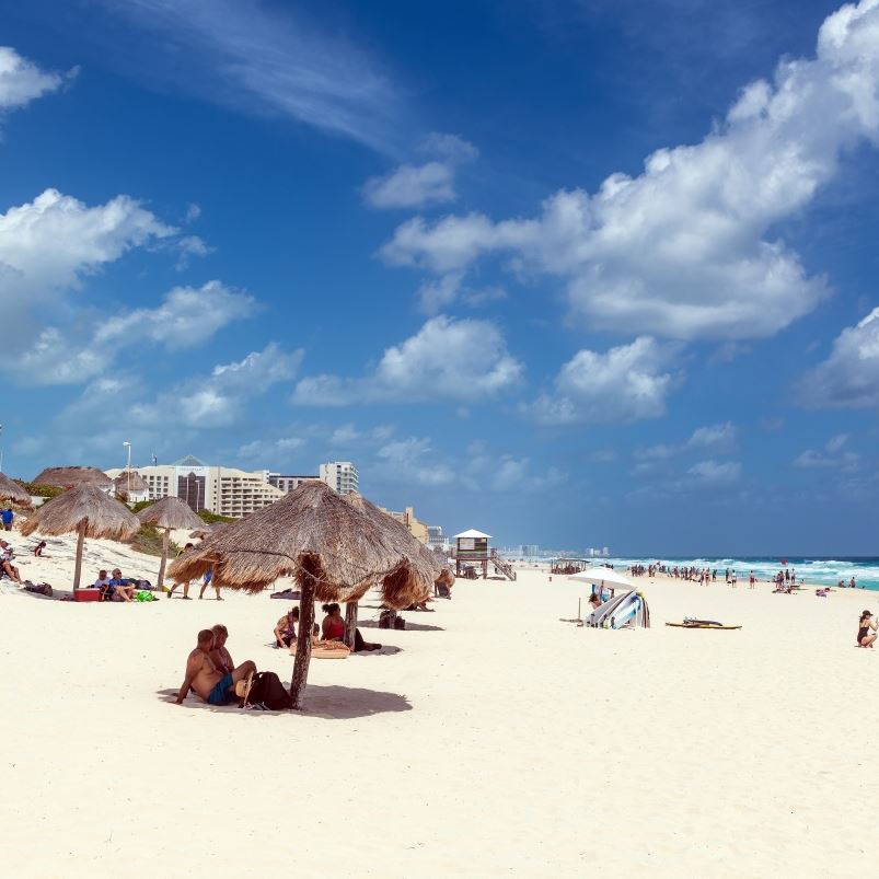 Tourists on Dolphin beach in Cancun, Yucatan peninsula.