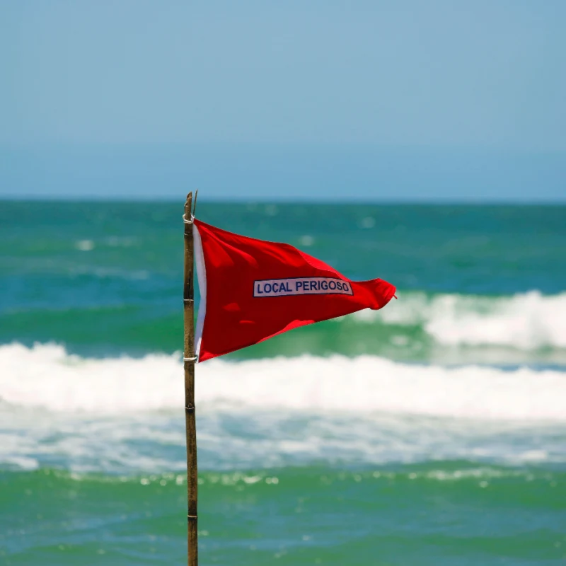 a red flag on a cancun beach 