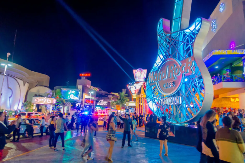 Tourists Walking Around in Front of the Hard Rock Cafe in the Hotel Zone in Cancun, Mexico