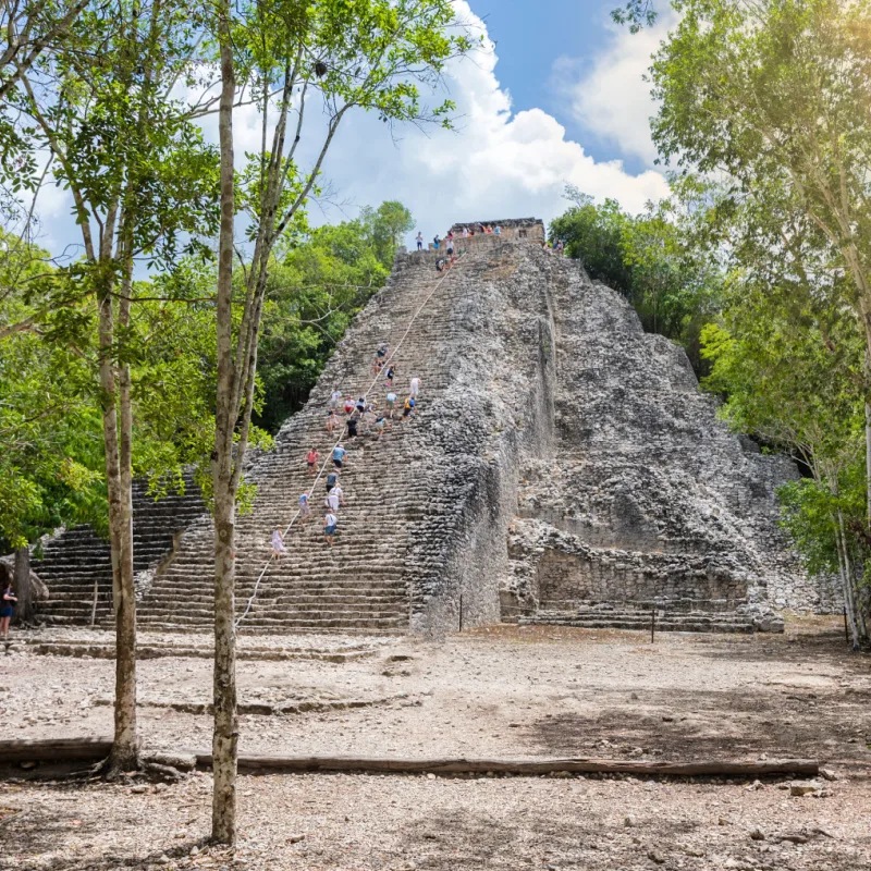 Ancient ruins of Coba near Tulum with a tall pyramid