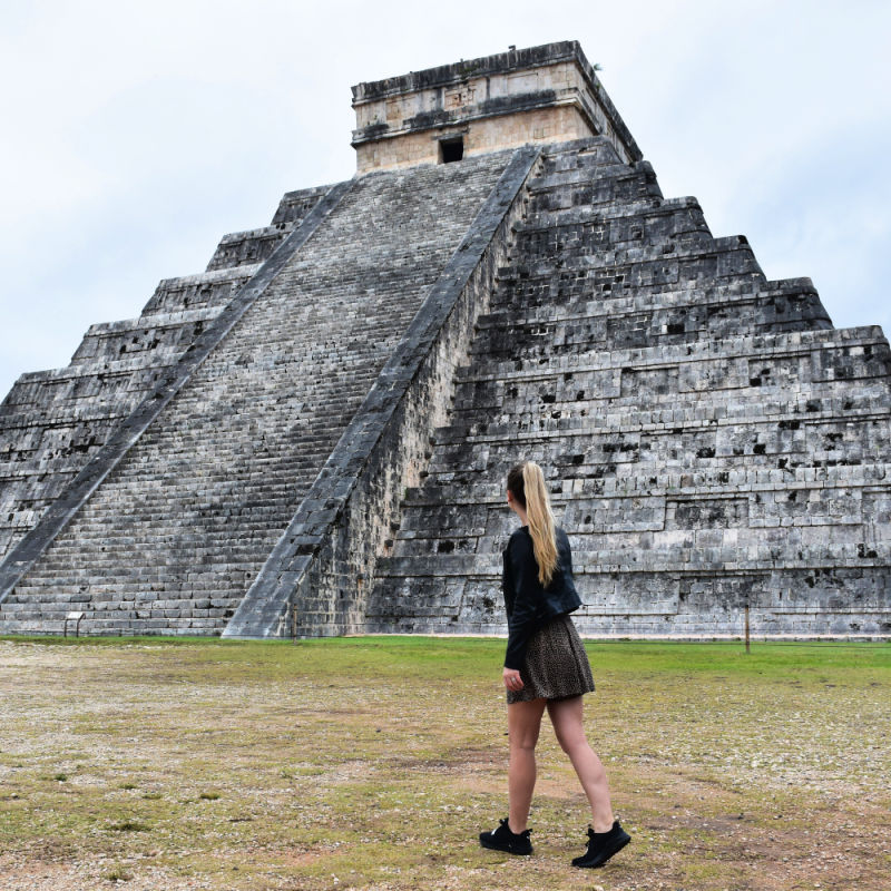 Tourist Walking in Front of the Main Pyramid at Chichen Itza
