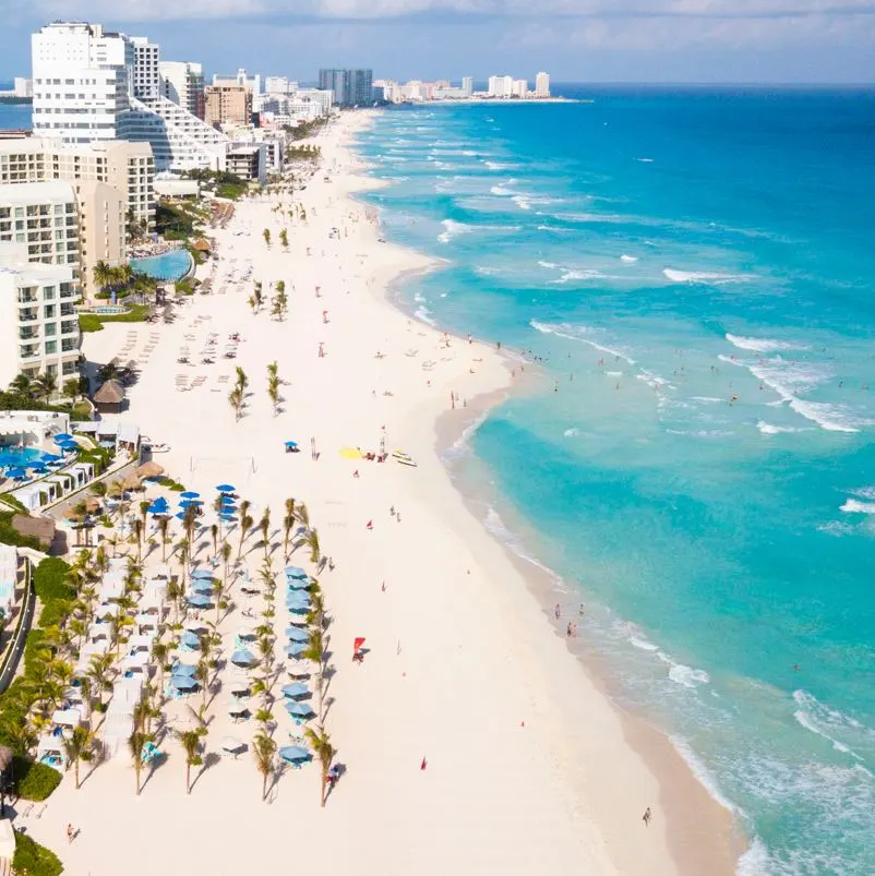 aerial view of a white sand beach in cancuns hotel zone