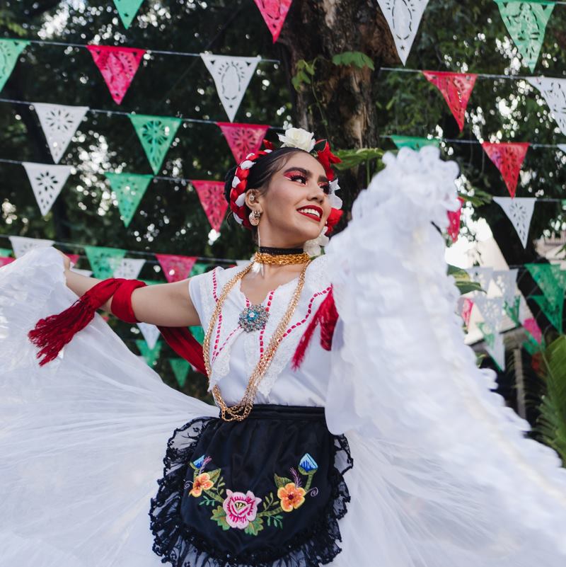 A mexican folk dancer in white