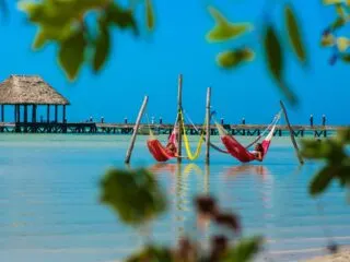 Women relaxing in hammocks in Punta Coco in the new beautiful island of Holbox
