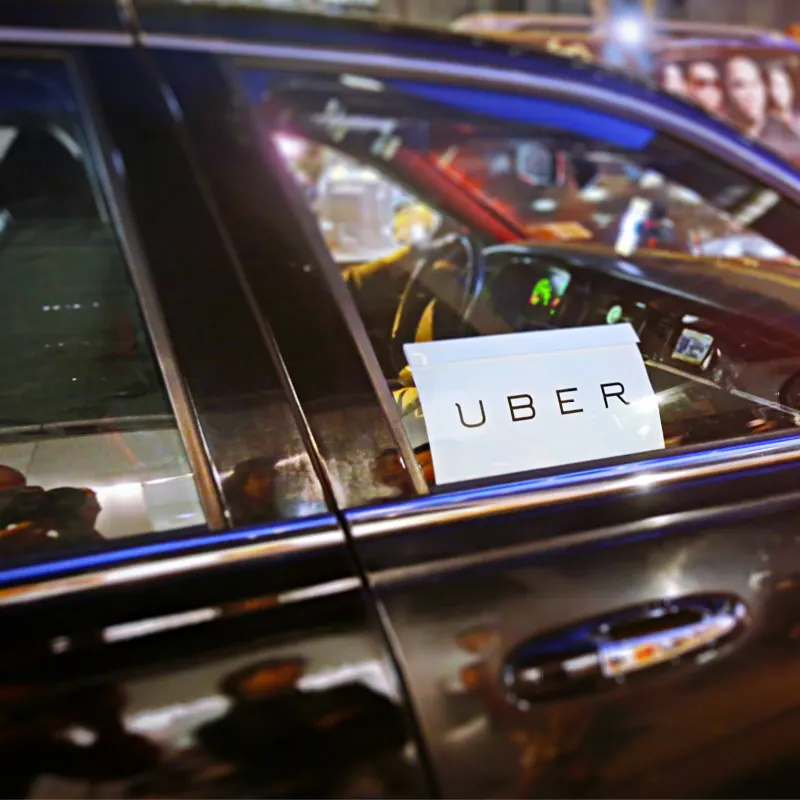 Uber Vehicle on the Road at Night