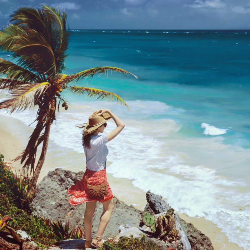 A female traveler admiring the view in Tulum