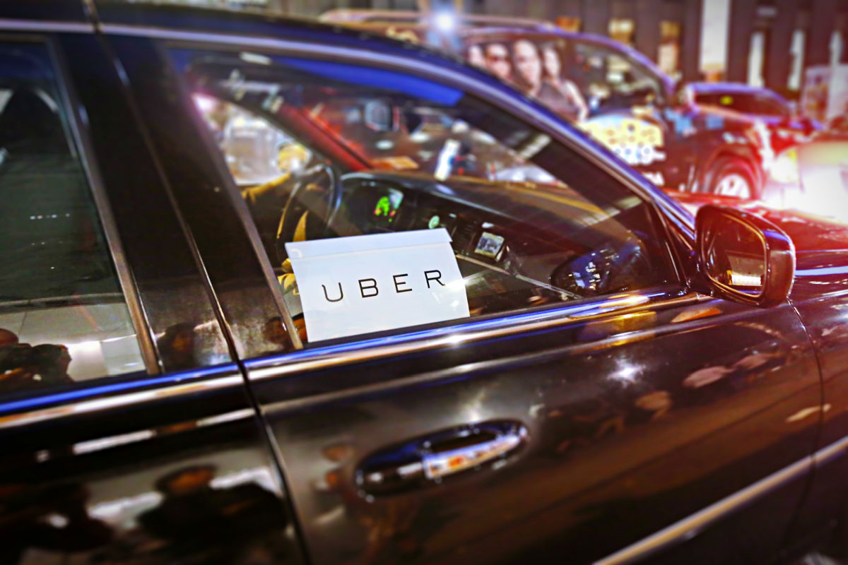 Uber Vehicle on the Road at Night