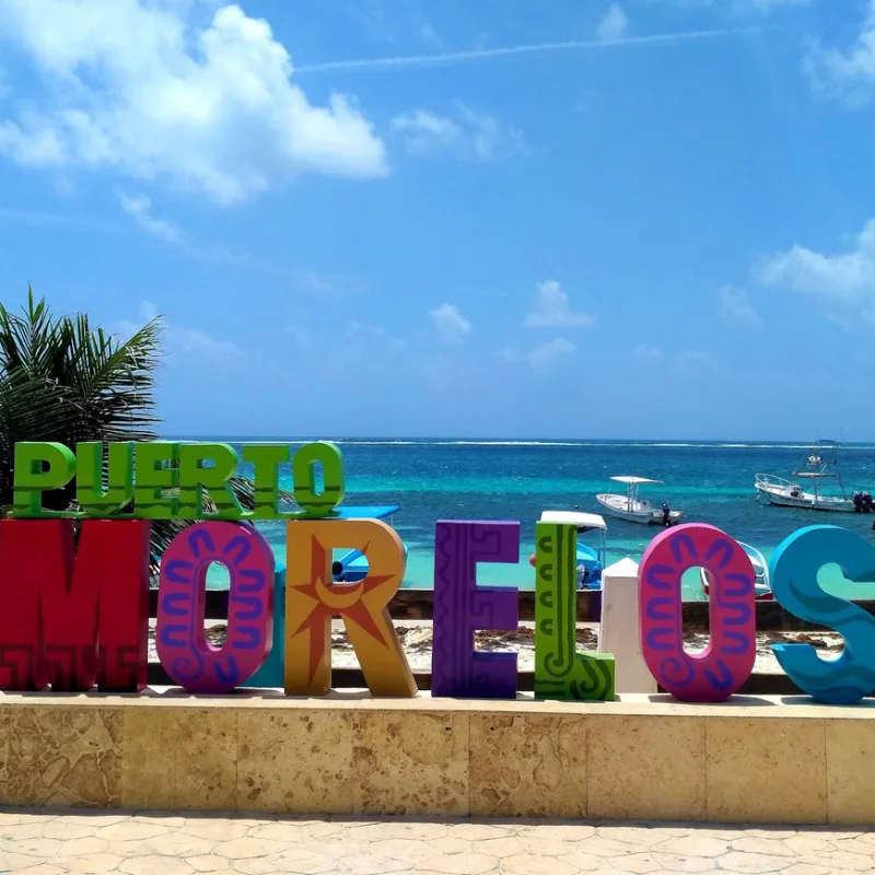 colorful puerto morelos sign on boardwalk