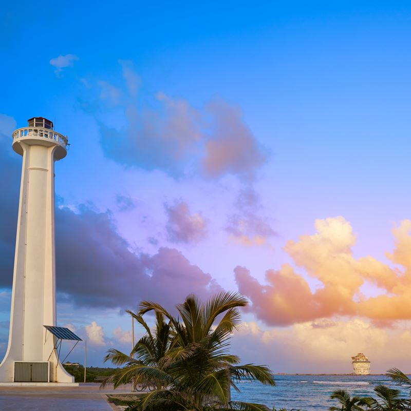 Mahahual lighthouse with a cruise ship in the background