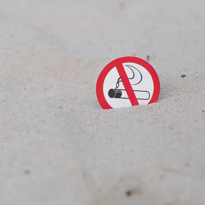 A no smoking sign on the beach