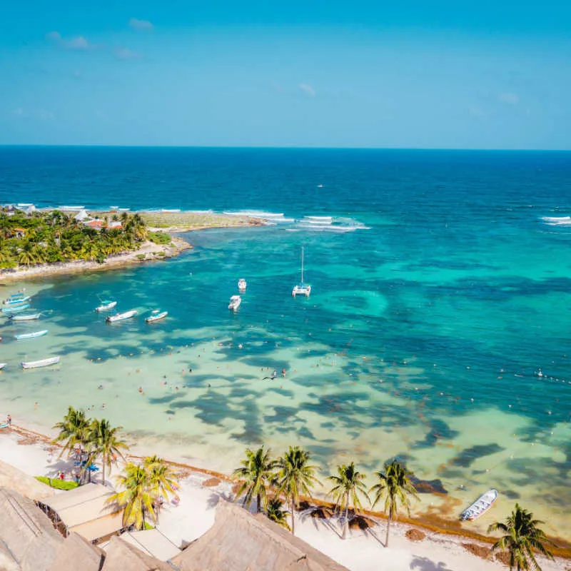 aerial view of a white sand beach in akumal