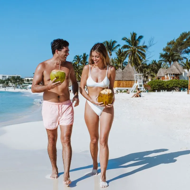 couple on a beach in Tulum