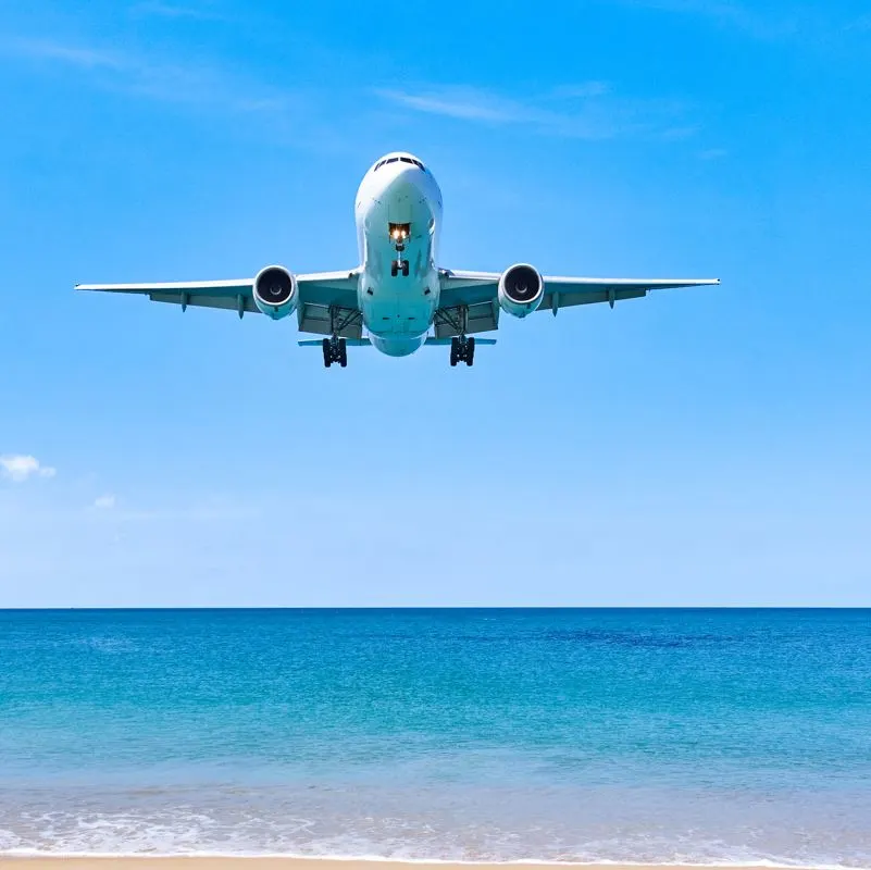 Airplane Flying Over the Mexican Caribbean