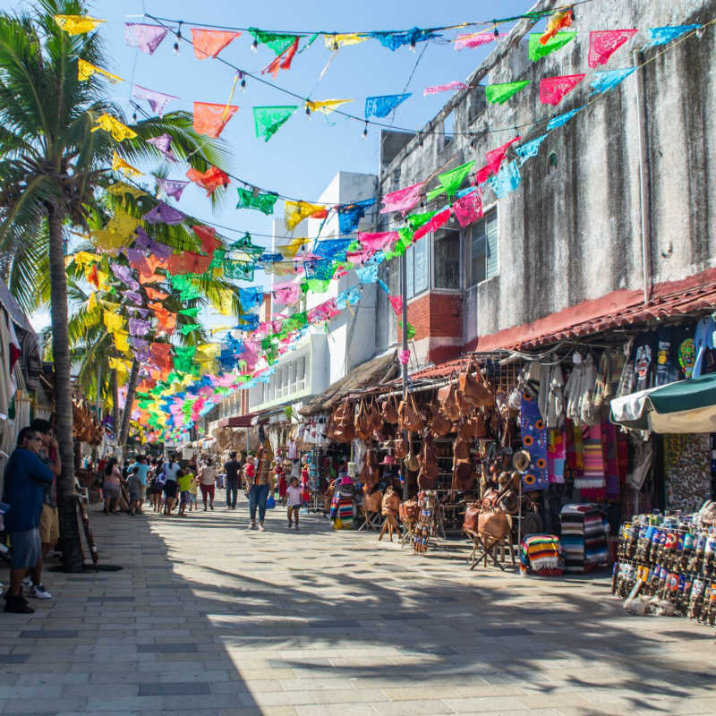 playa del carmen fifth avenue with colorful flags
