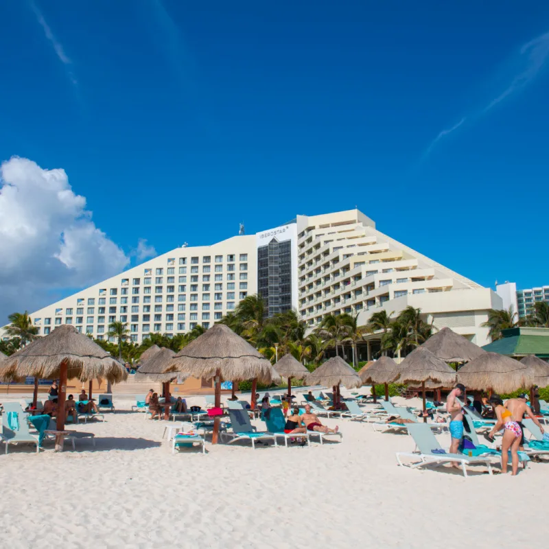 Tourists on a Beach in Front of an All-Inclusive Resort in Cancun, Mexico