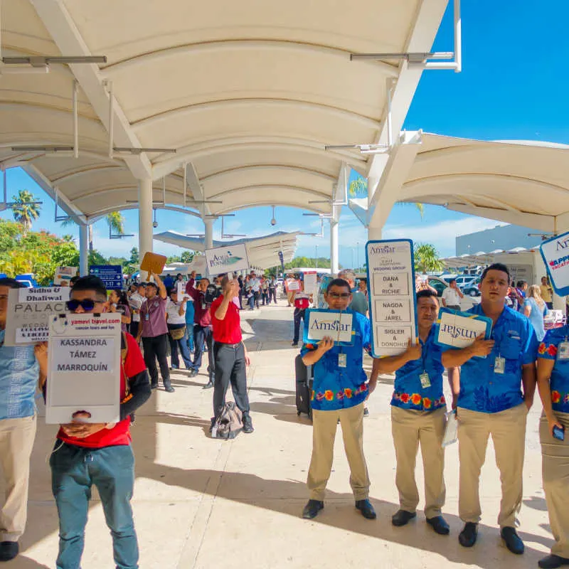 Taxi Drivers Trying to Get Passengers at Cancun Airport