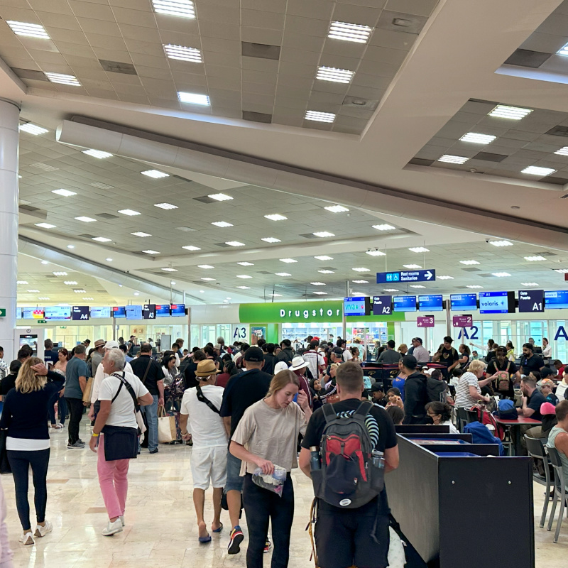 Tourists inside of Cancun International Airport